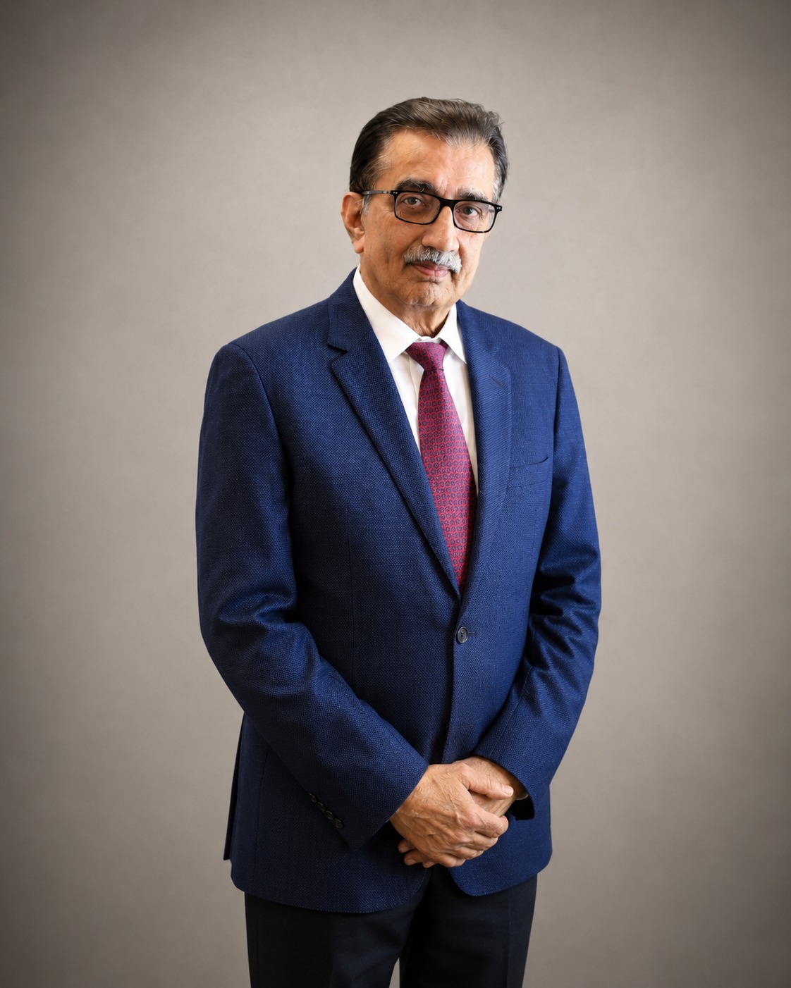 Iqbal Ali Lakhani - Chairman